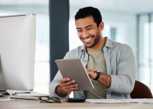 Shot of a young businessman using his digital tablet