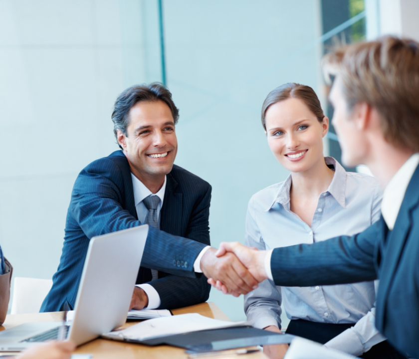 Executives giving handshake
